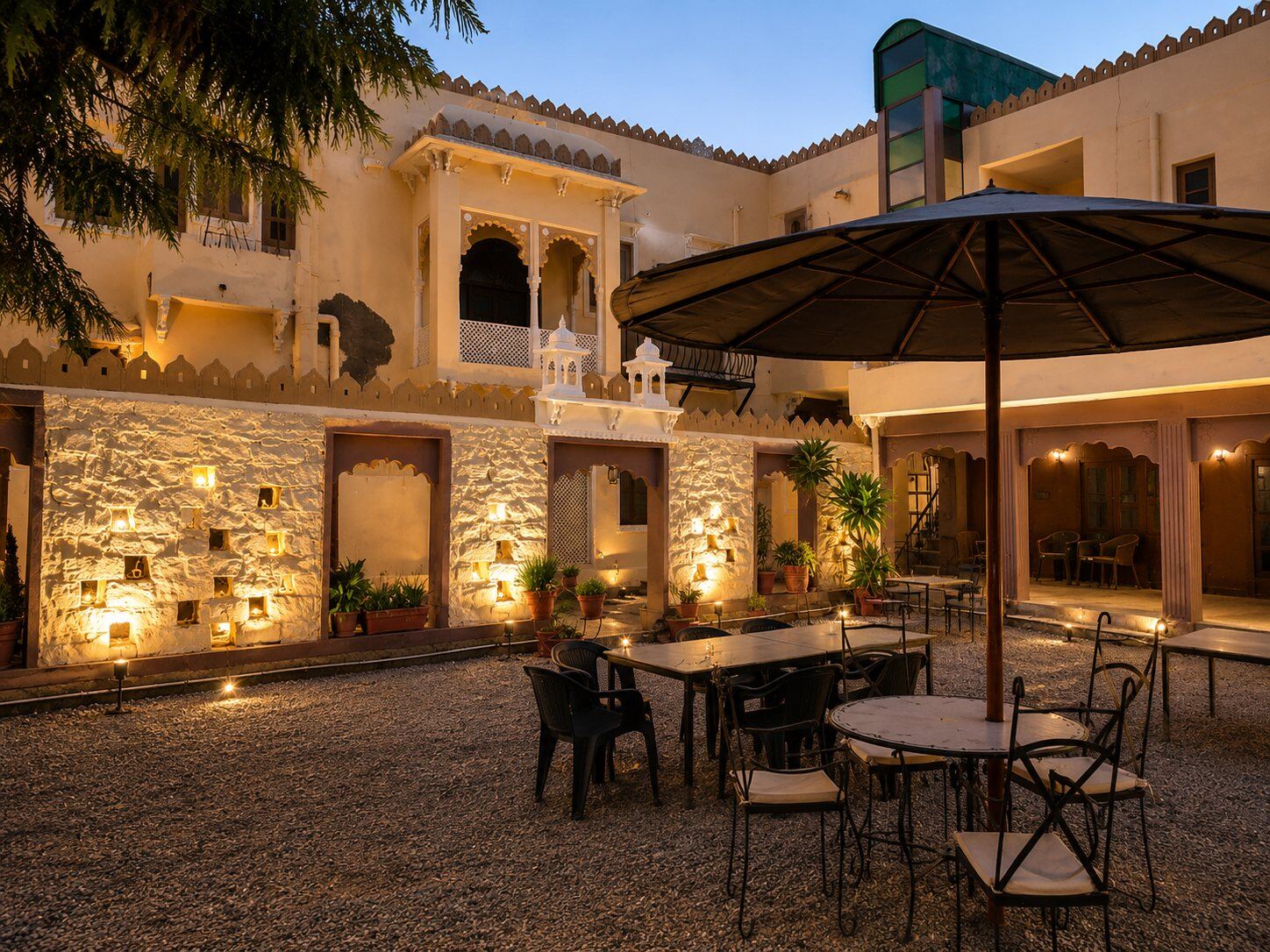 Anniversary dinner set up in the courtyard at dusk